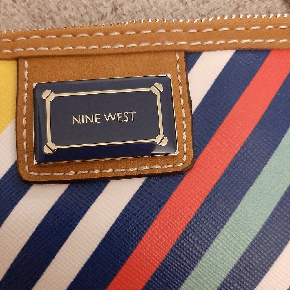 nine west  hand/shoulder bag. New without tag. Never worn. Stripe.